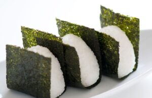 rice ball (often triangular, sometimes with a filling and wrapped in nori)